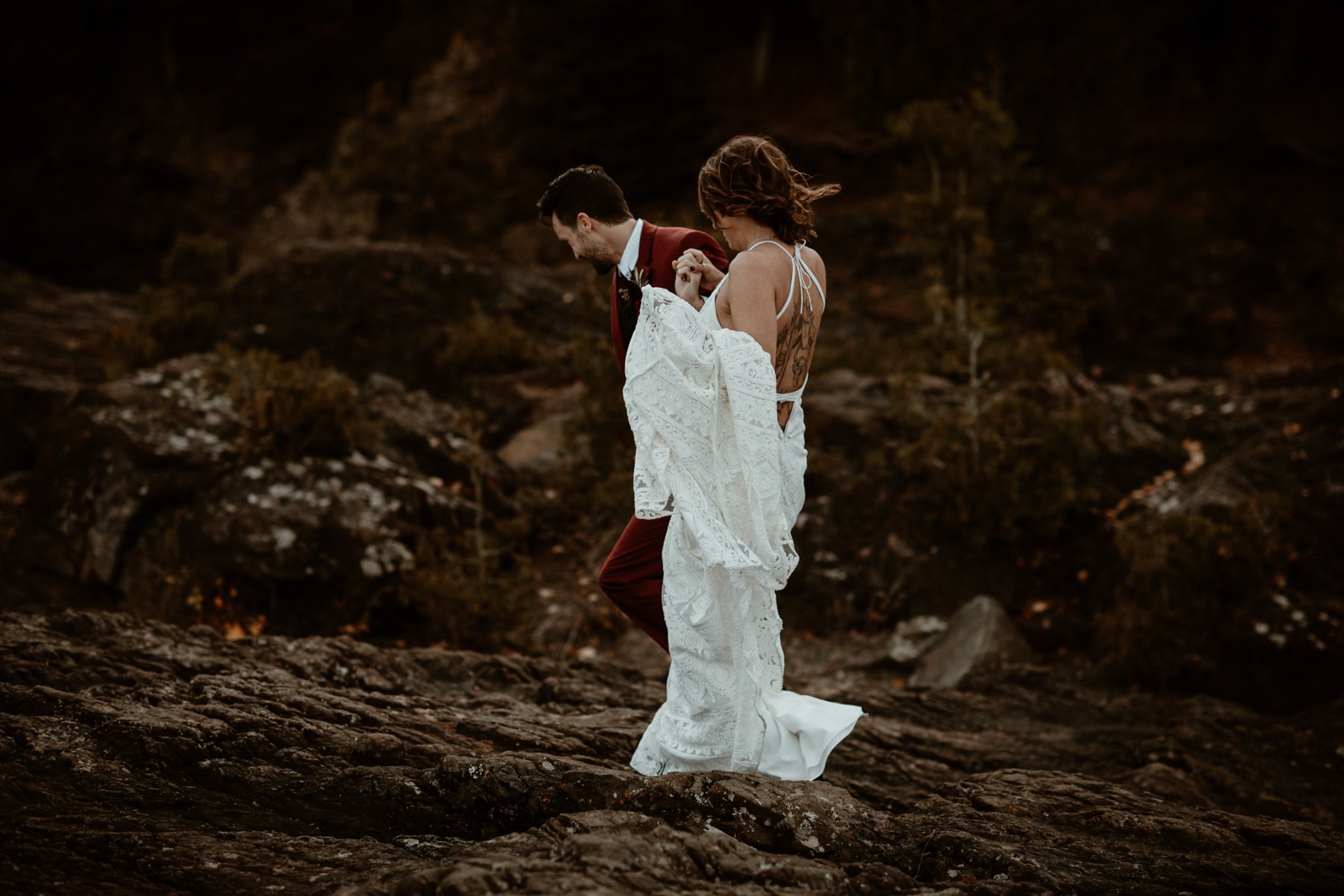 Bride and groom at the black rocks on Preque Isle in Marquette.