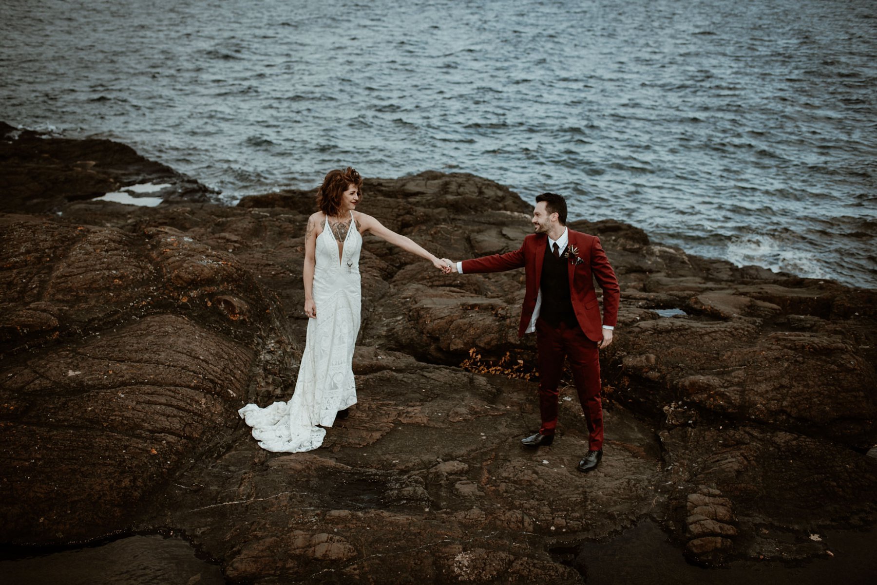 Bride and groom at the black rocks on Preque Isle in Marquette.