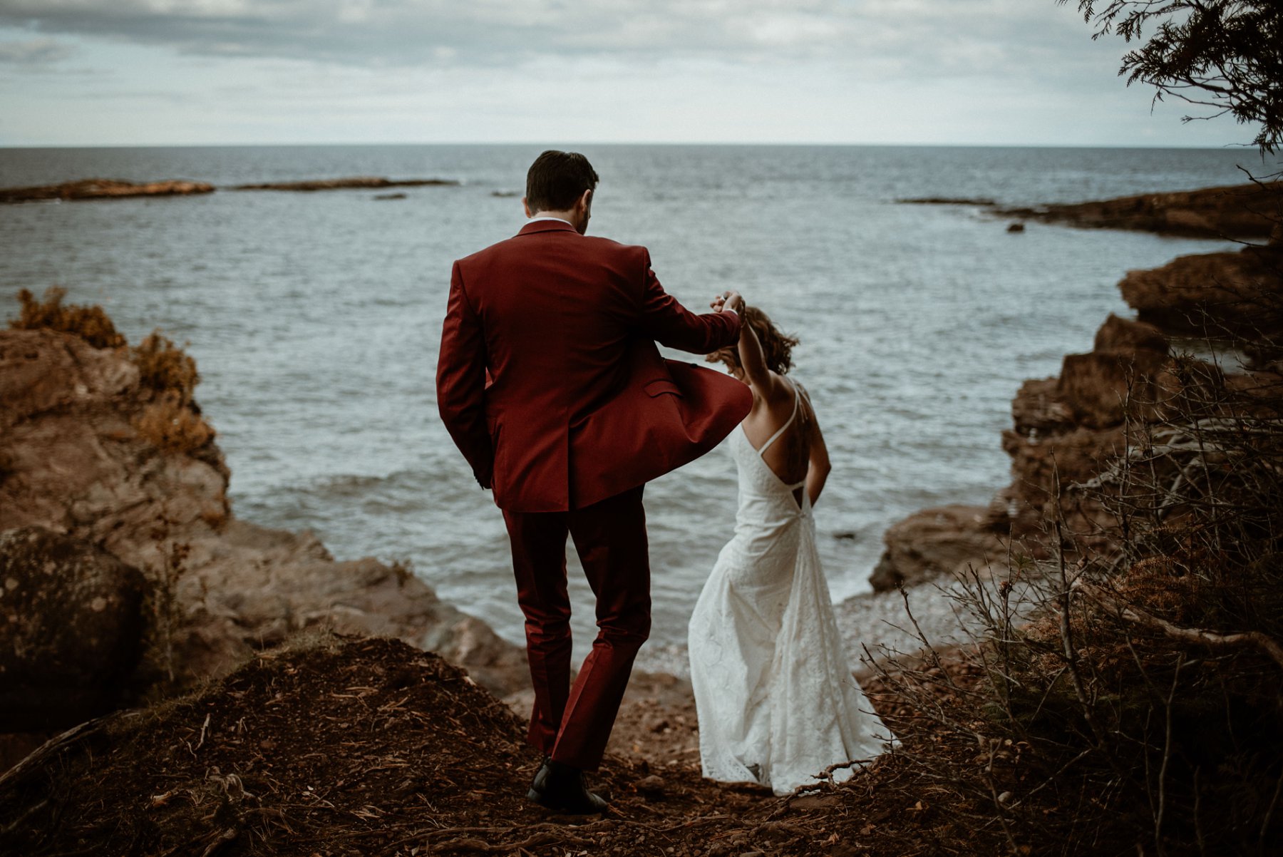 Bride and groom at the black rocks on Preque Isle in Marquette.