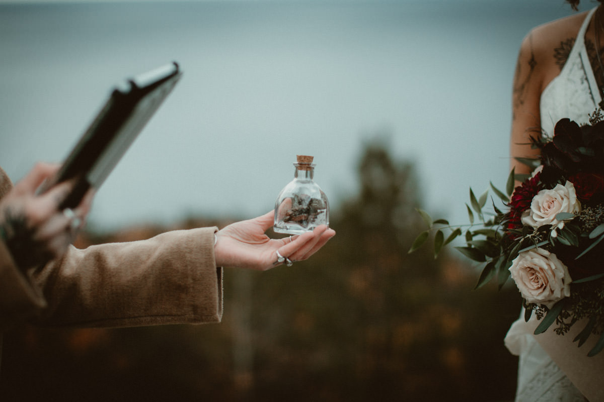 Decorative bottle of elements from a wedding ceremony.