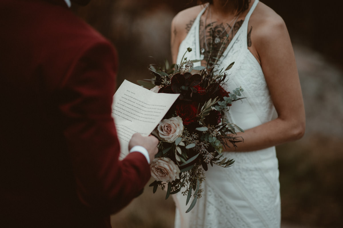 Reading vows at elopement ceremony