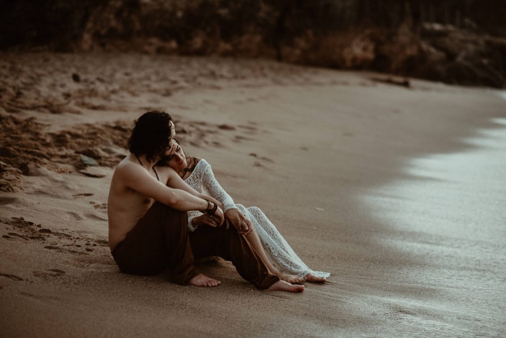 Elopement couple snuggling on the beach in Puerto Rico