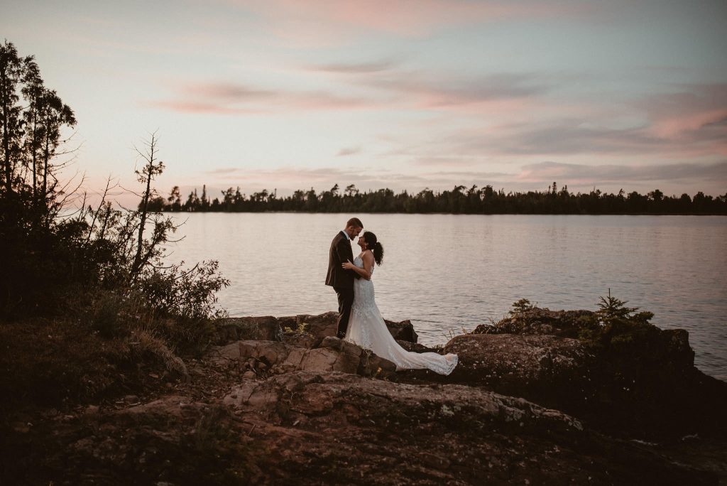 Bride and groom portraits on Lake Superior at sunset