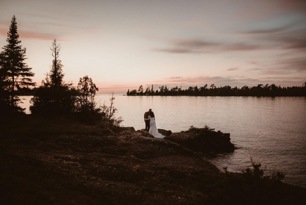 Bride and groom portraits in Copper Harbor, Michigan at sunset