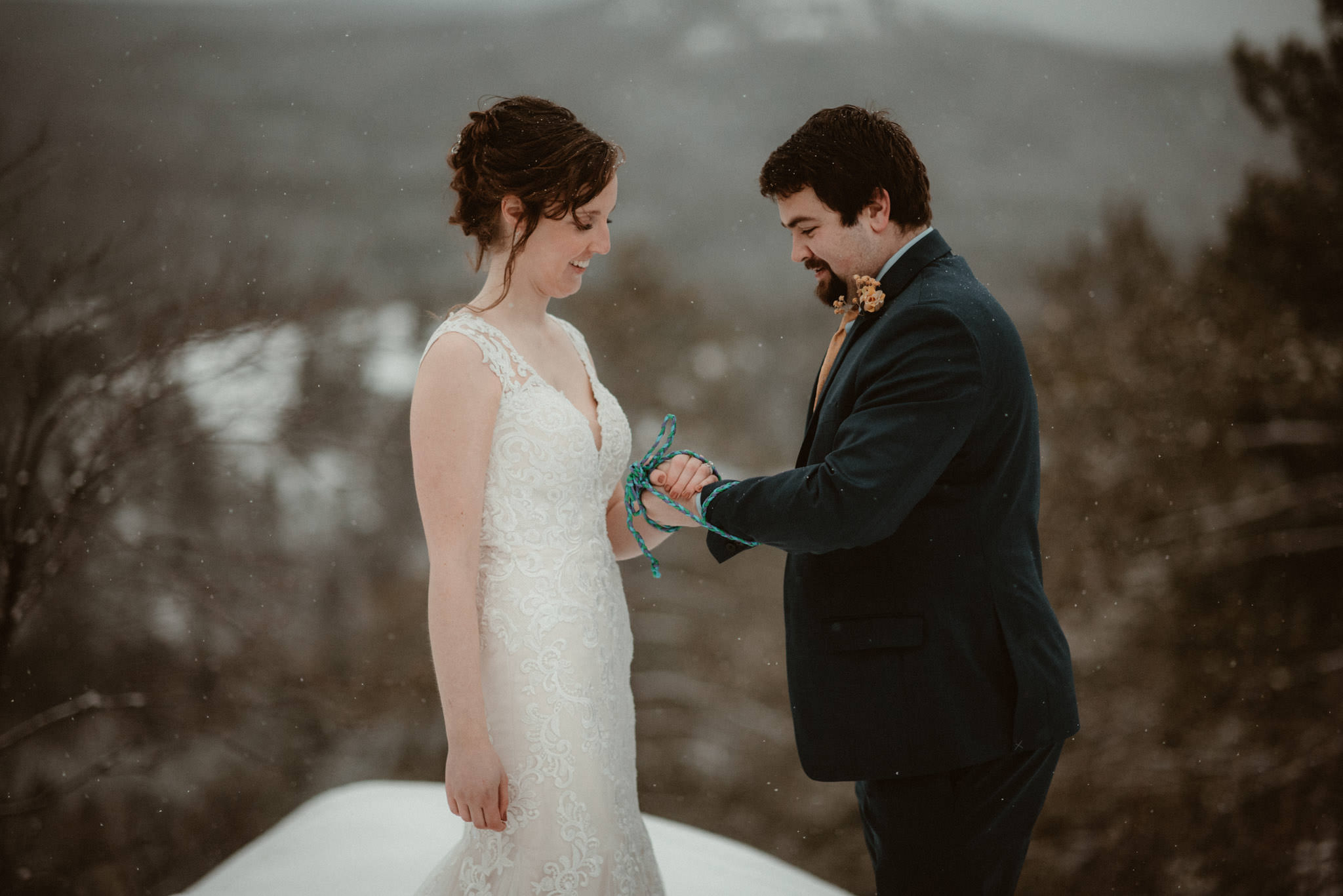 Handfasting ceremony at elopement on Sugarloaf Mountain in Marquette, MI