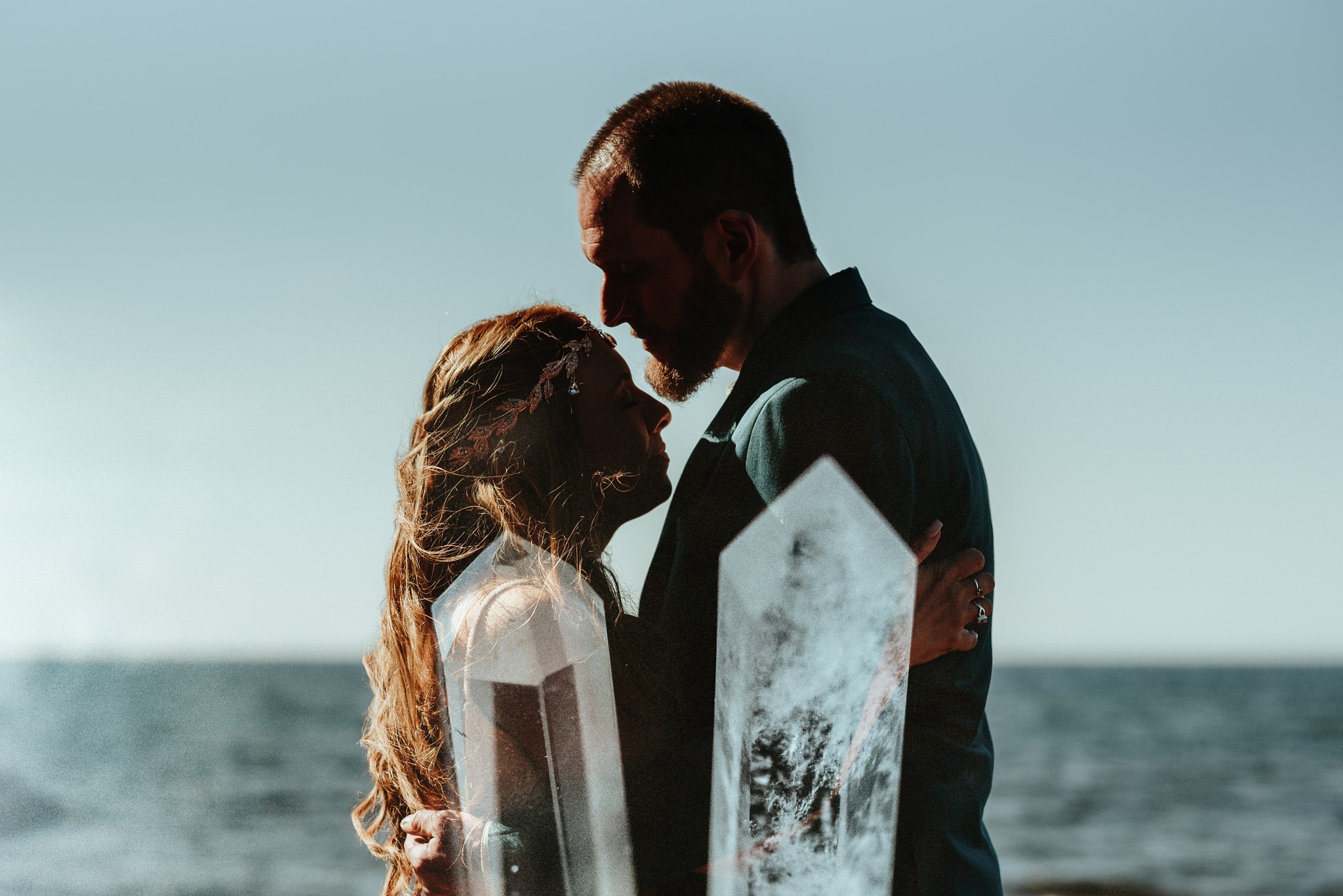 The couple's silhouettes with quartz crystals double exposed.