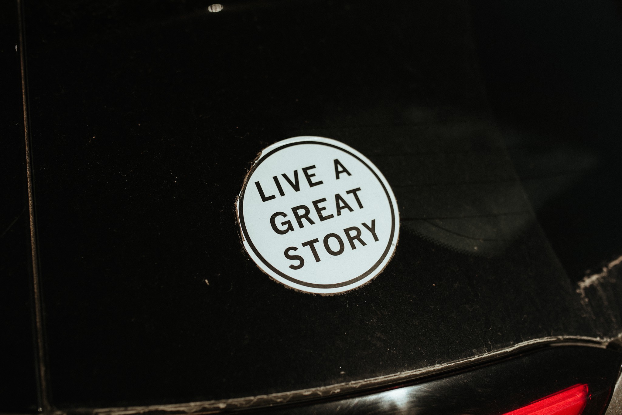 A sticker on their car: "Live a great story."