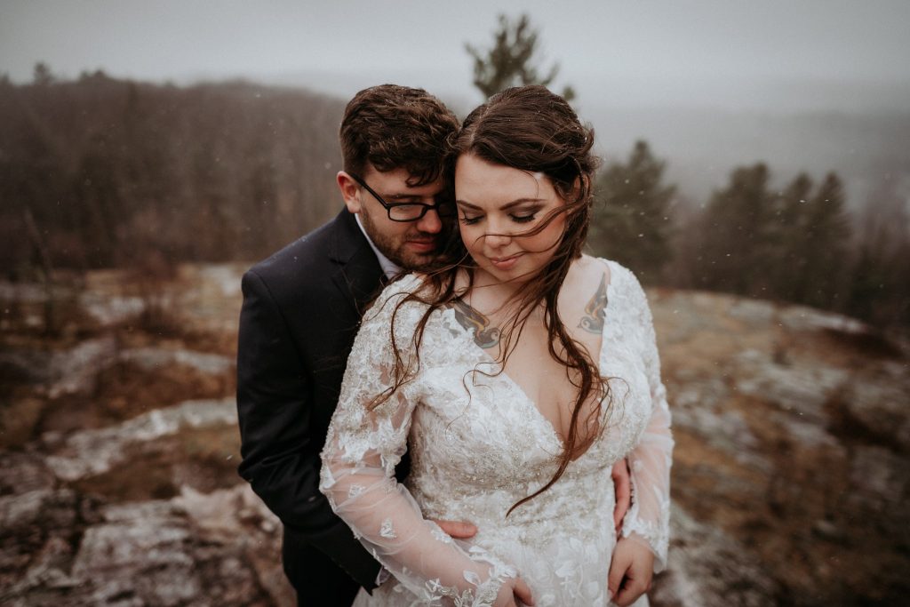 Intimate photo of a bride and groom on Marquette Mountain in Michigan's Upper Peninsula.